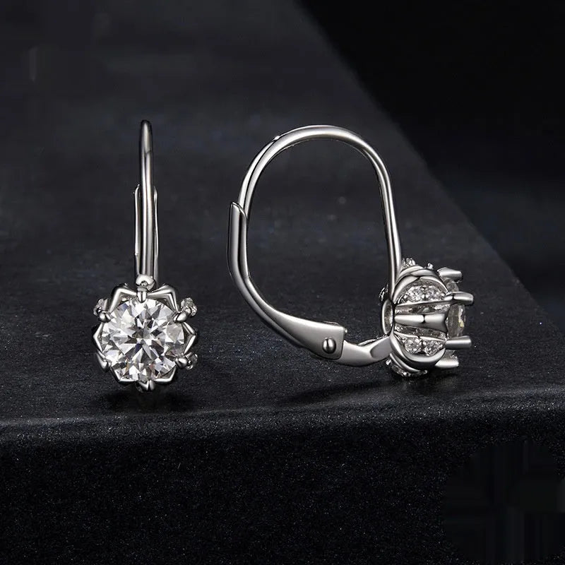 Sterling silver flower bud ear clip with white gold plating and 0.5 carat moissanite stone