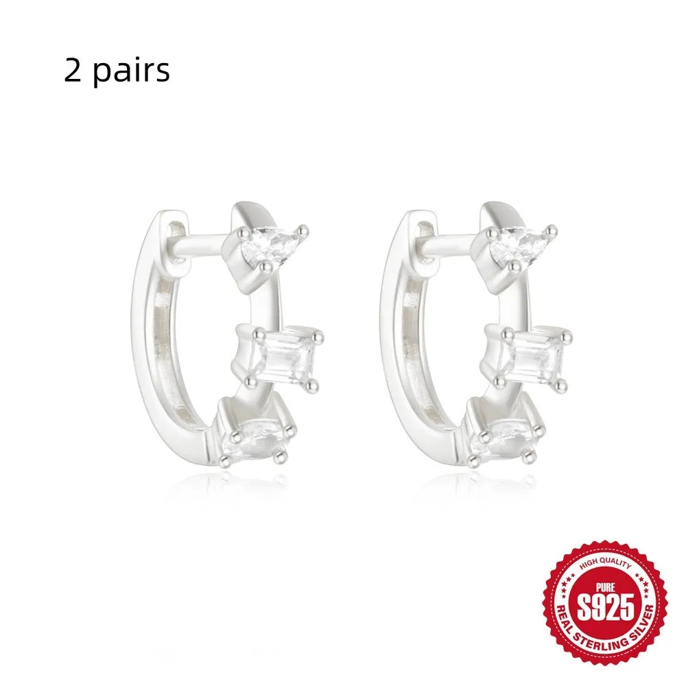 Sterling silver geometric stud earrings with diamond detailing in gold or silver finish
