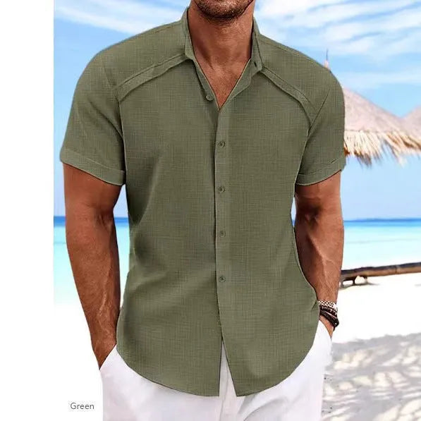 Hawaiian casual short sleeve solid colour shirt in a cotton blend fabric on a hanger.