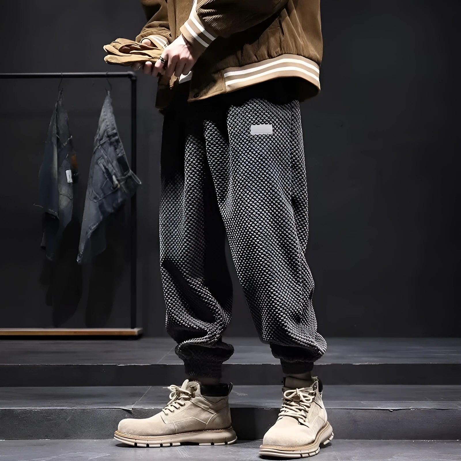 Men's grey ankle-tie casual sweatpants with straight leg design on hanger