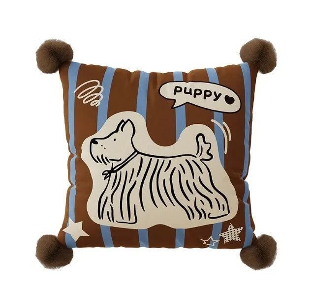 Blue cartoon animal printed cushion on a grey sofa showing removable cover.