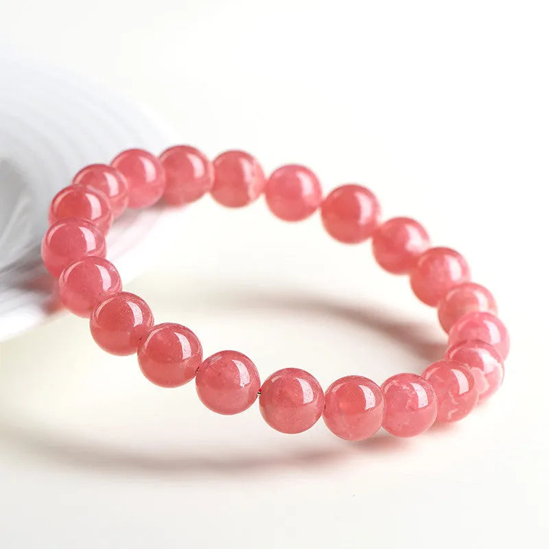 Natural red rhodochrosite crystal bracelet with geometric beads and longevity lock closure