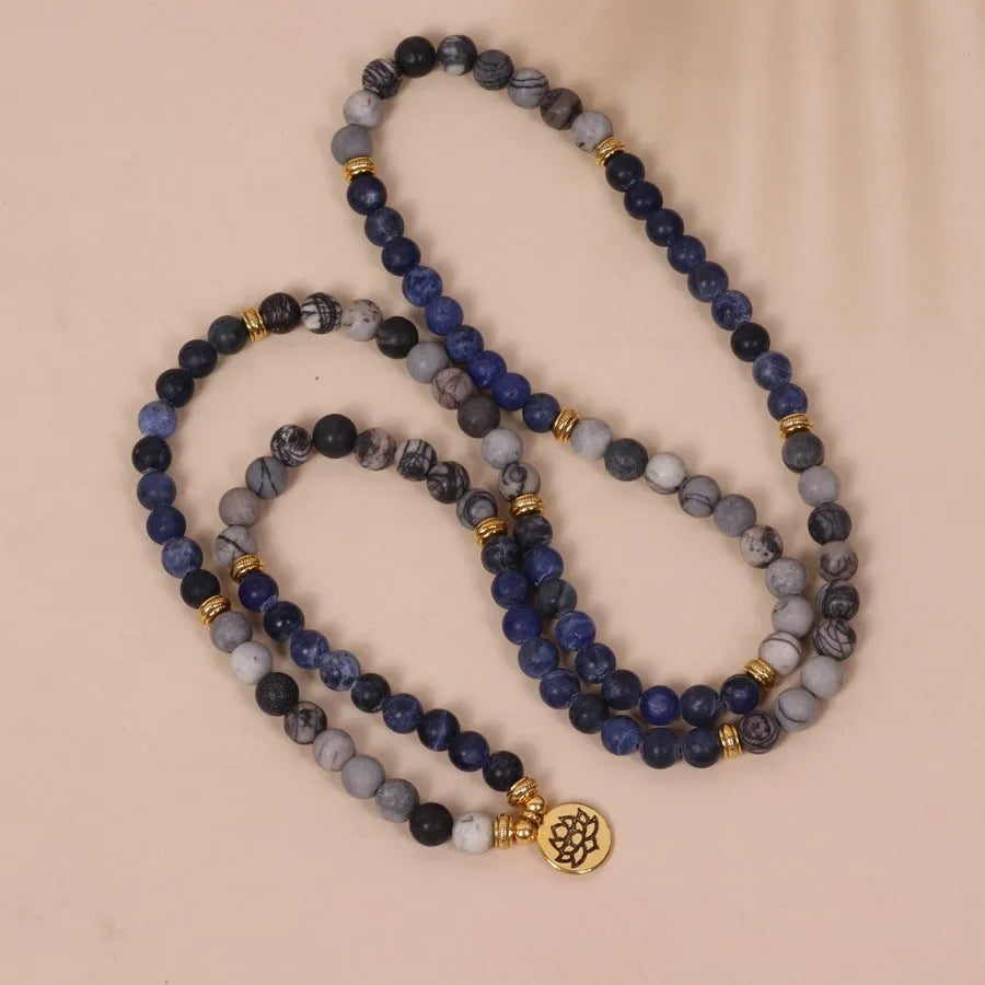 Layered multi-strand bracelet with blue patterned network stone beads and alloy toggle clasp