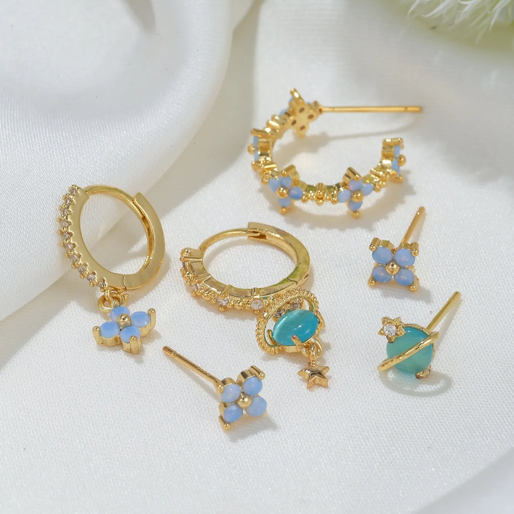 Gold or silver flower ear studs with zircon mosaic centre detail geometric design