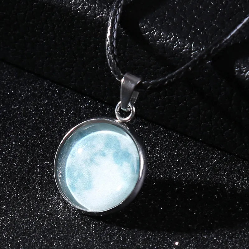 Luminous moon and constellation design pendant on an alloy necklace chain with extension.