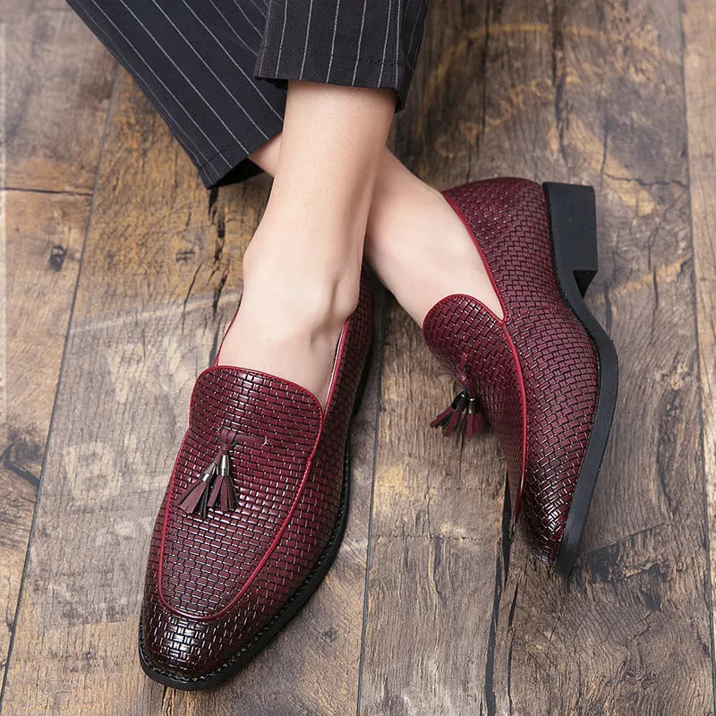 Men's black pointed toe slip-on business shoes with tassel detail on artificial PU leather upper