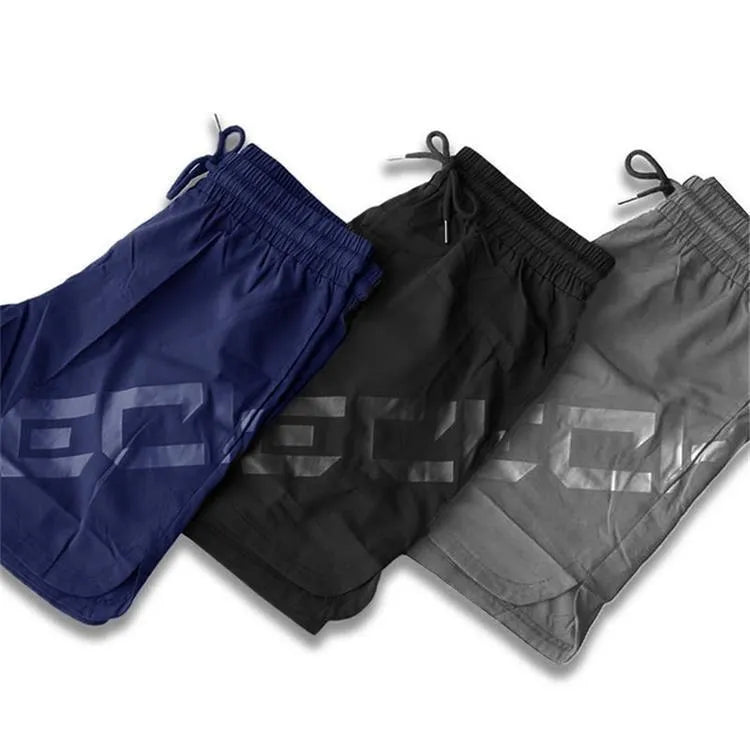 Men's black quick-dry elastic training shorts with knee-length design for summer sports