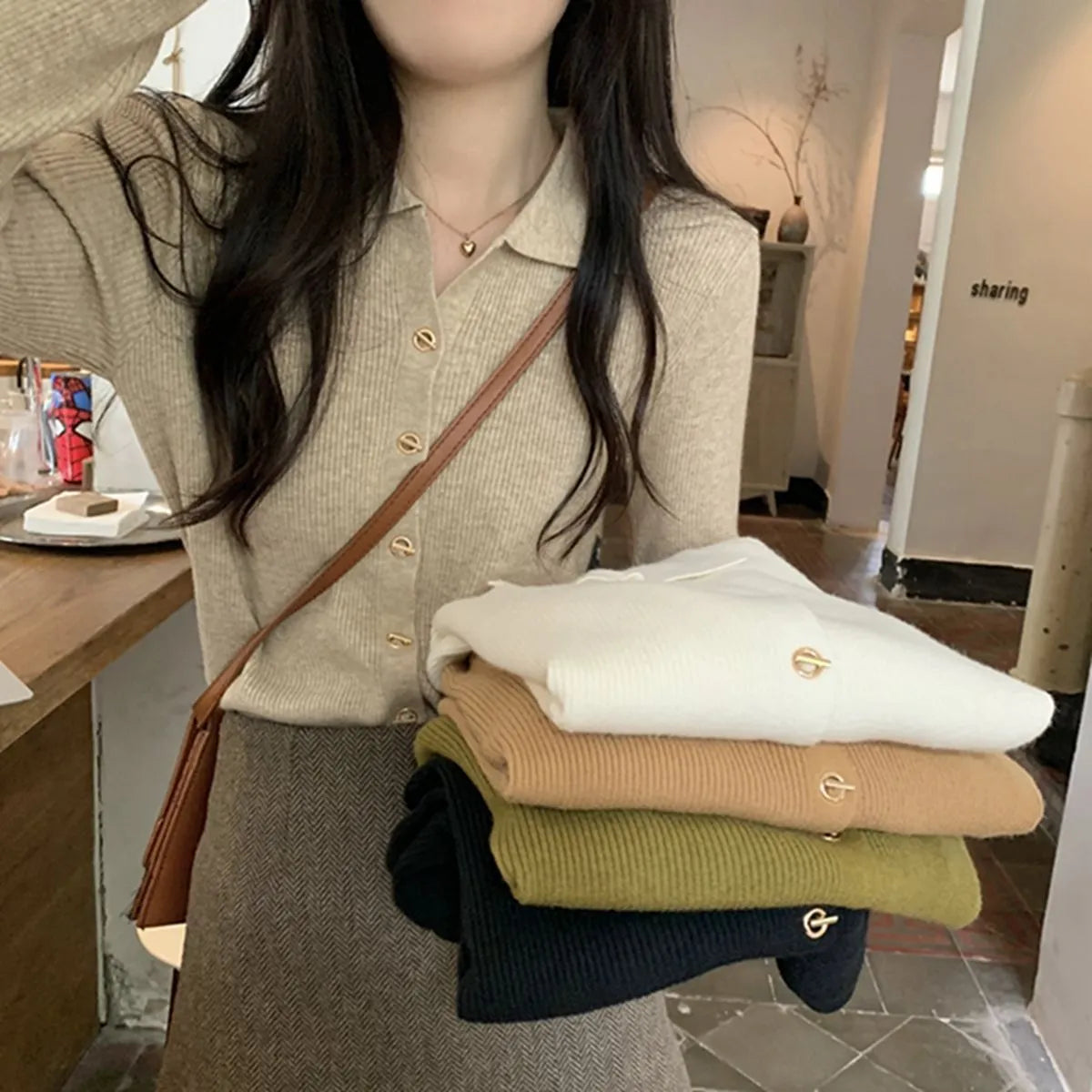 Beige viscose knitted cardigan with long sleeves displayed as bottoming top