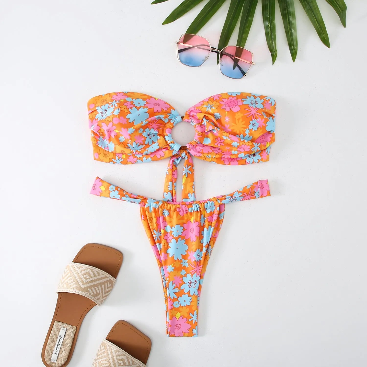 Women's floral printed tube top ring bikini set with backless design on mannequin