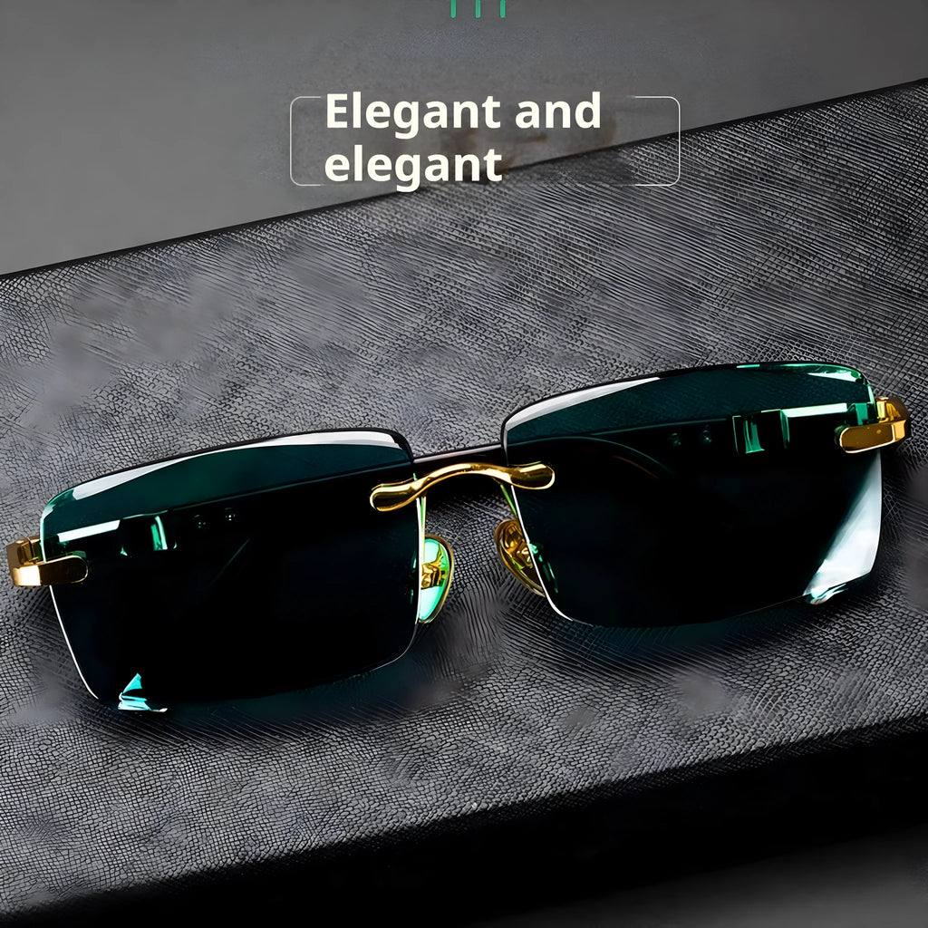 Dark green frameless crystal sunglasses with case and cleaning cloth on a solid background.