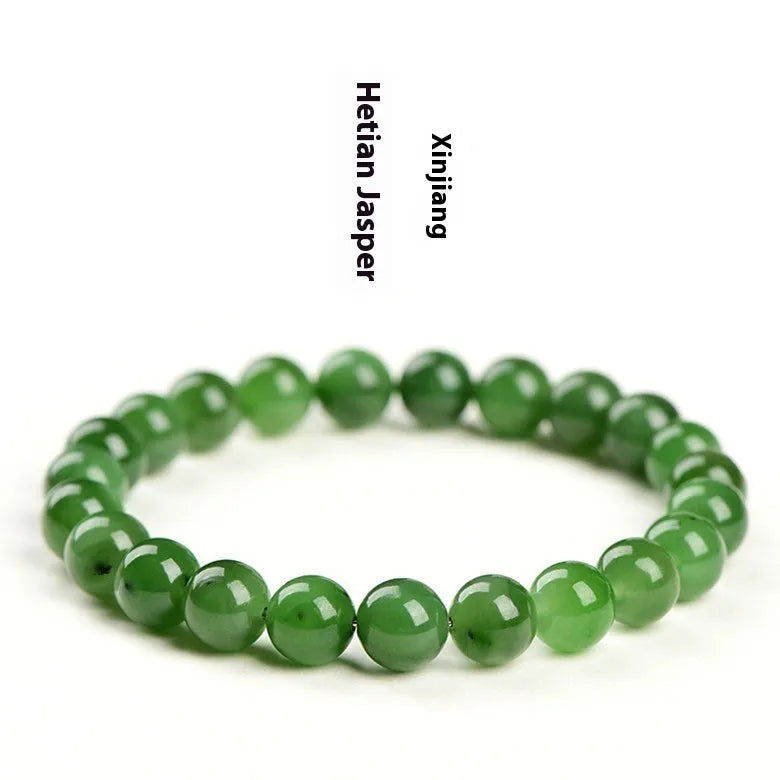 Natural Hetian jade bead bracelet in jasper colours, showing polished beads on a wrist.