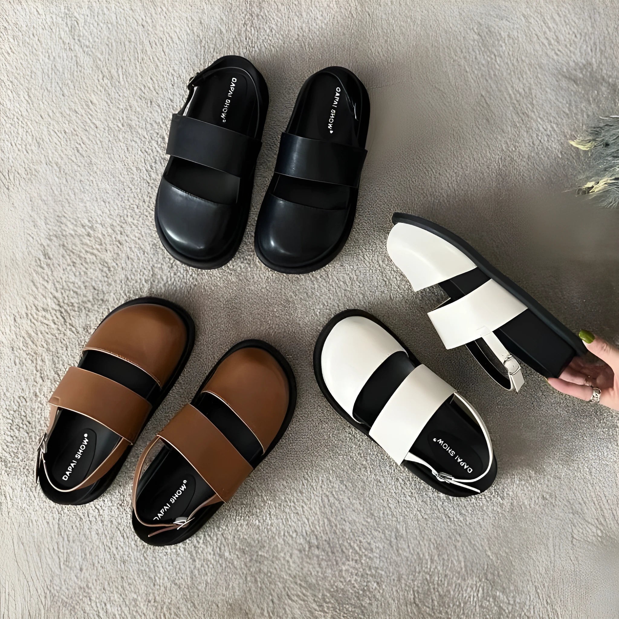 Retro closed toe sandals with raised bottom, ankle strap buckle, and round toe in apricot colour