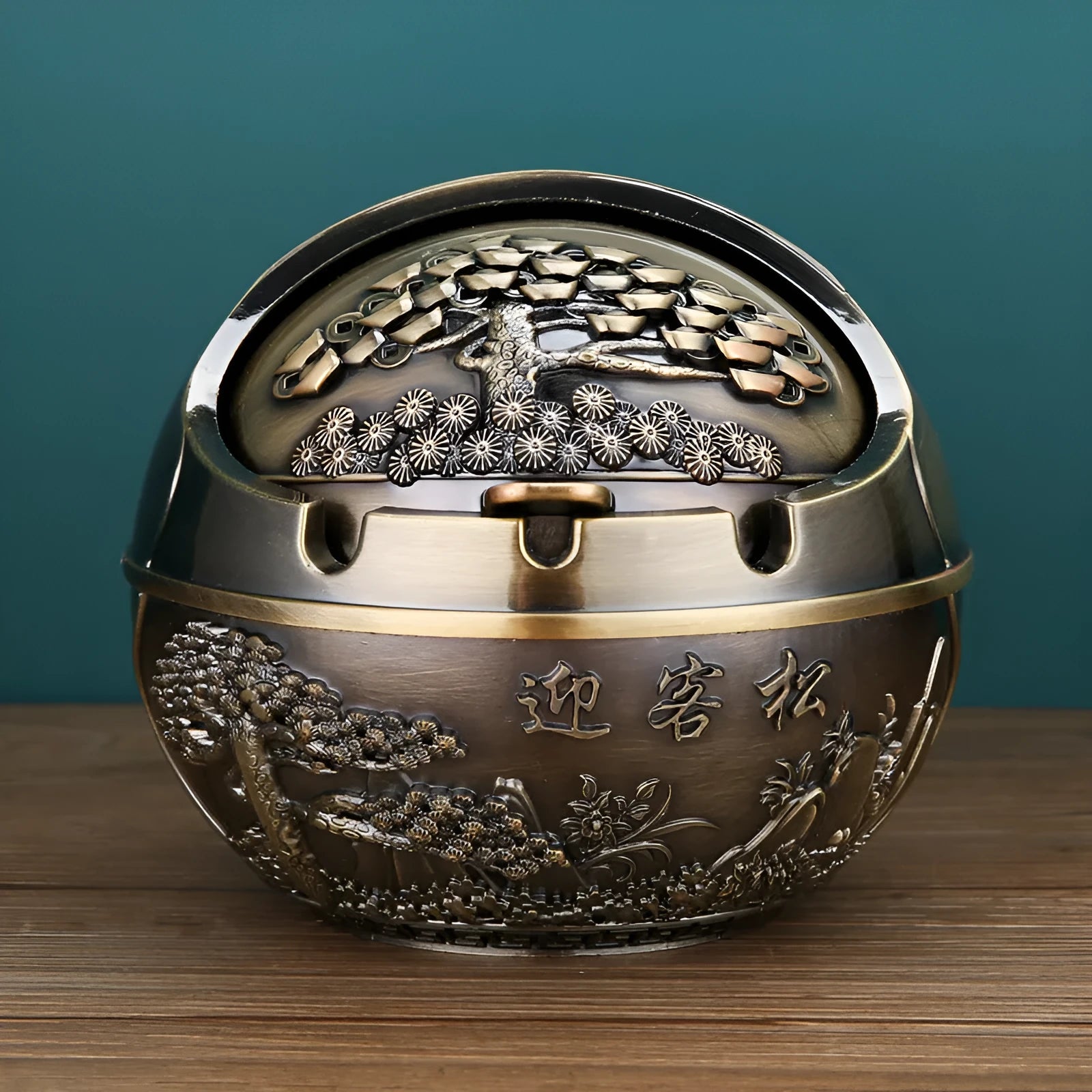 Alloy ashtray with smoke extinguishing slot in bronze finish featuring decorative dragon and phoenix design