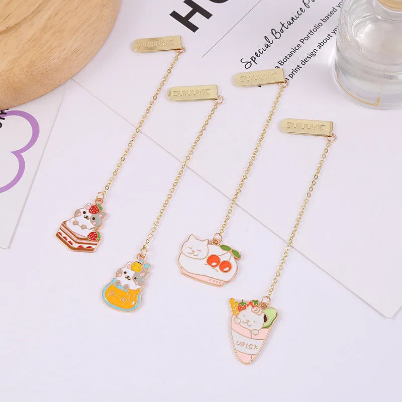 Metal bookmark with cartoon cat pendant in one of four designs measuring 3.8cm by 18.3cm