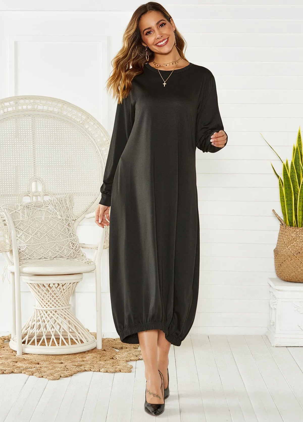 Black lantern dress with lace-up crew neck and loose silhouette casual knit fabric