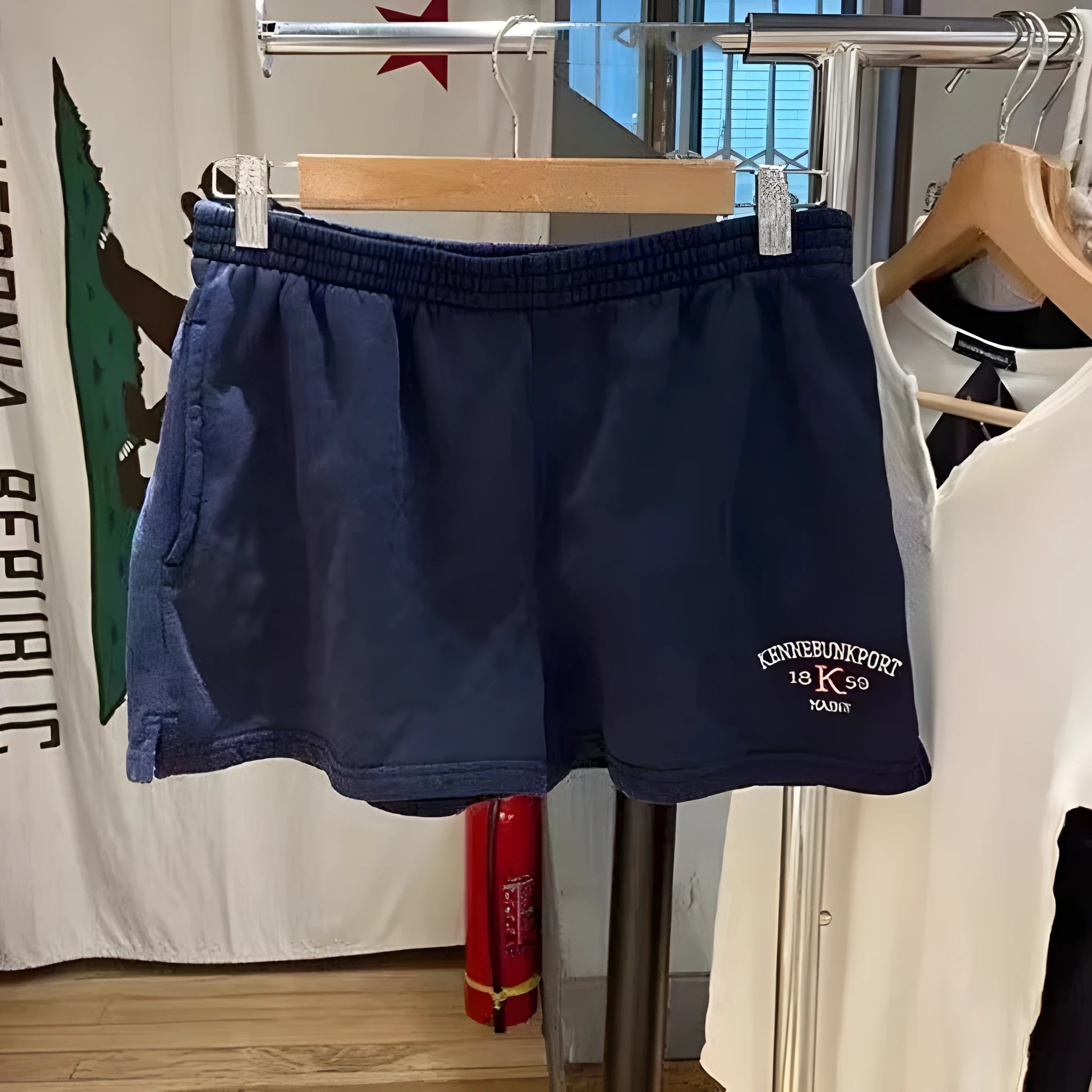 Women's dark blue cotton sports hot pants with white flag embroidery, shorts length design