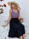 Purple sleeveless dress with hand-stitched floral embroidery on the front, shown on a mannequin.