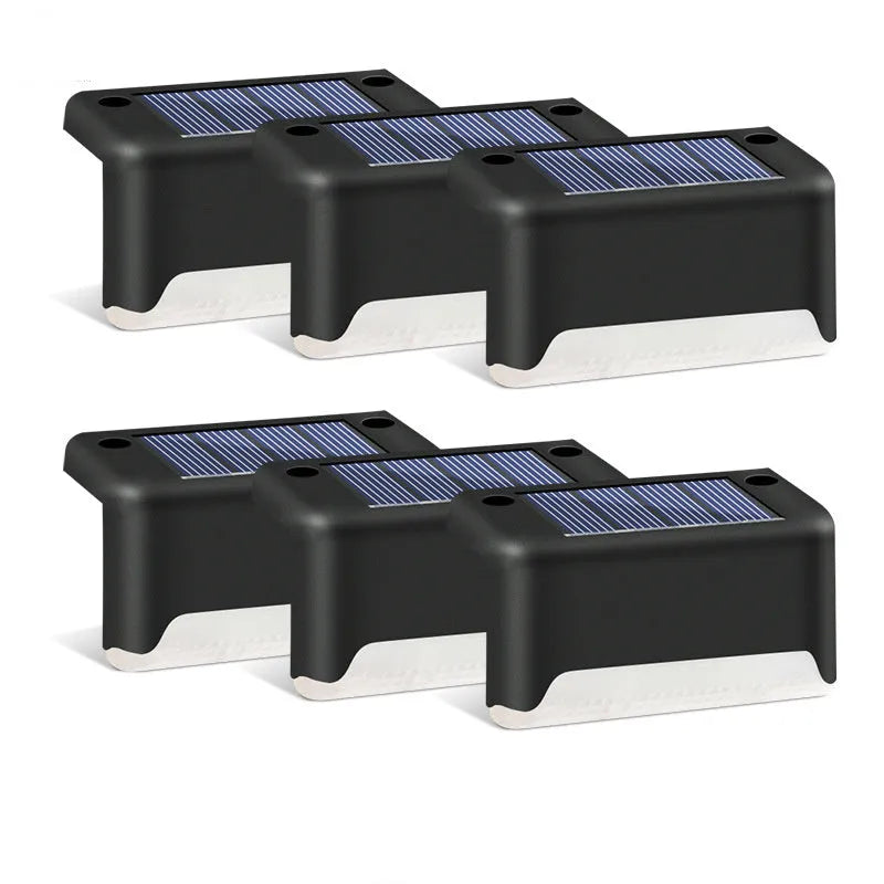 Solar garden stair light in black with warm light, compact ABS housing for outdoor courtyard use