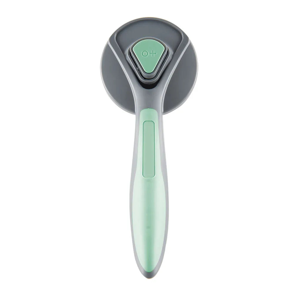Grey, green, and pink self-cleaning slicker brush for cats and dogs with a non-slip handle.