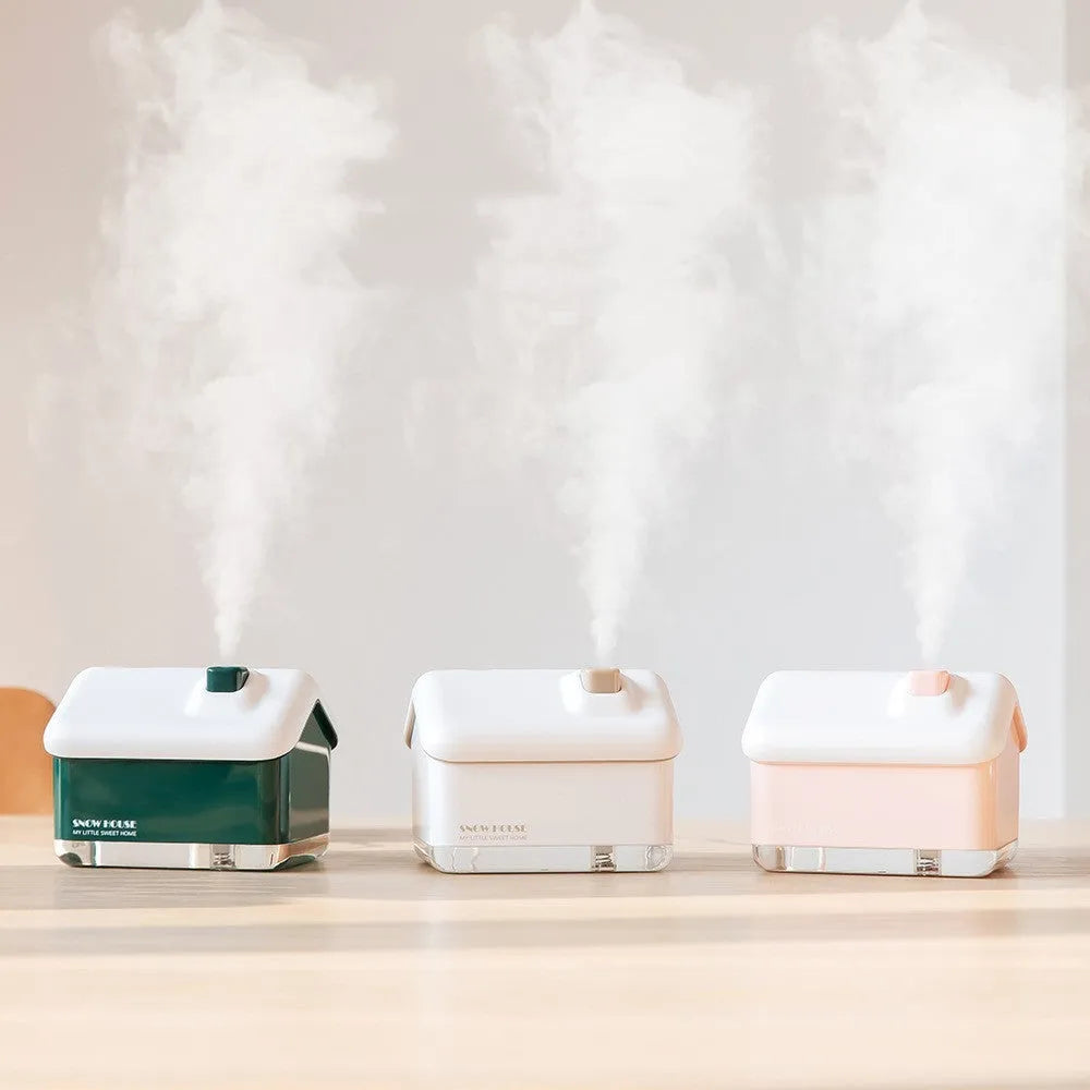 Mini igloo air humidifier in snow house shape with USB cable on desk