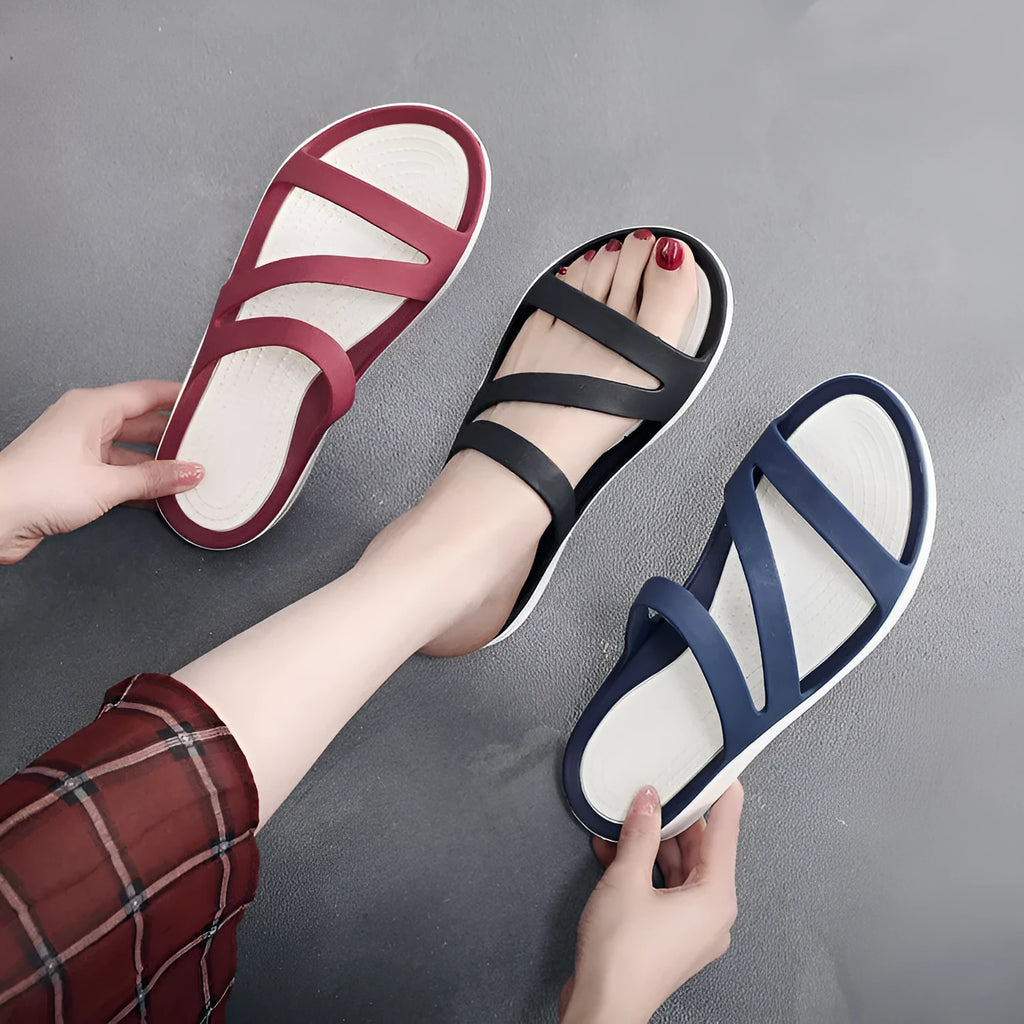 A pair of solid colour women's casual sandals with a breathable upper, shown in one of the six available colours.