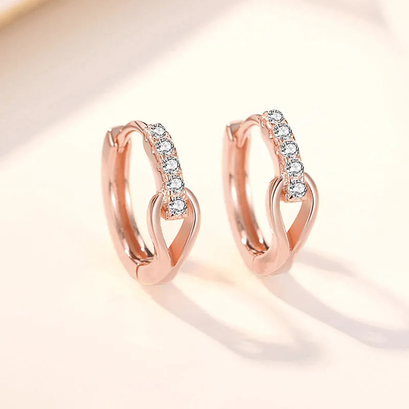 Copper geometric earrings with inlaid zircon in white gold colour on women