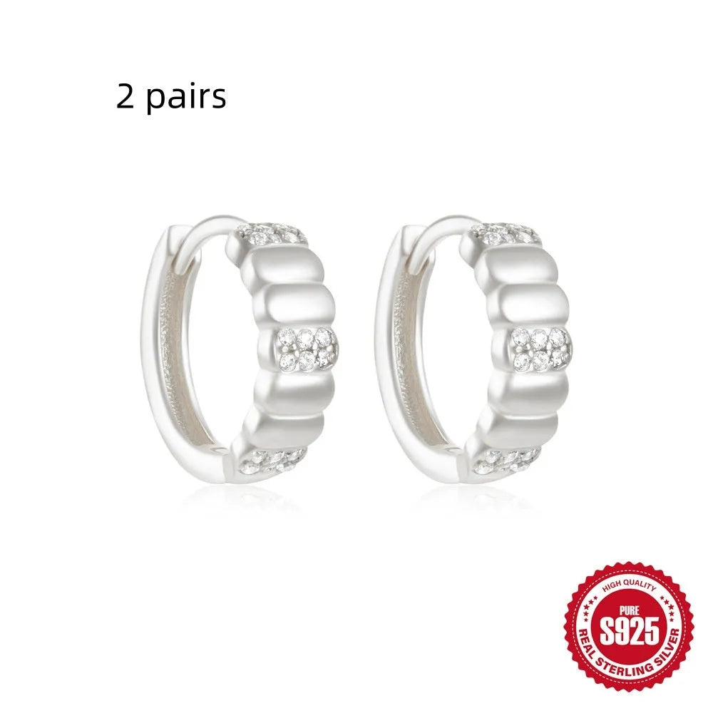Sterling silver geometric stud earrings with diamond detailing in gold or silver finish