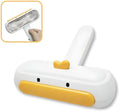 Portable yellow duck pet hair remover tool with polyester bristles for furniture and car seats.