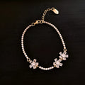 Women's geometric copper bracelet with gold-coloured finish and zircon stone detailing