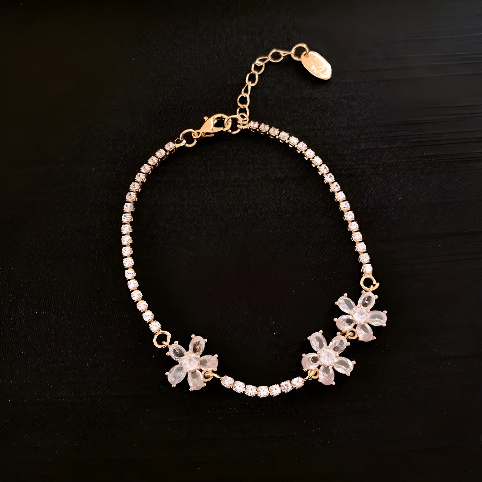 Women's geometric copper bracelet with gold-coloured finish and zircon stone detailing