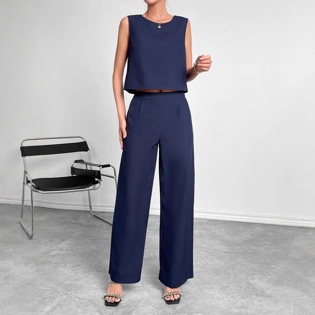 Women's red polyester two-piece set with sleeveless top and wide leg trousers displayed flat