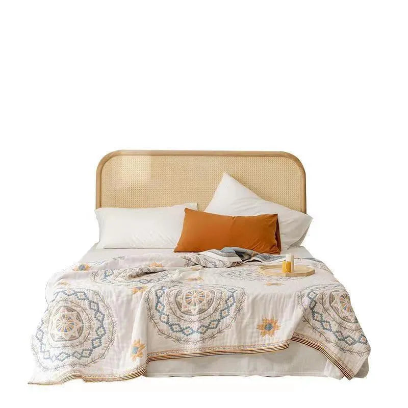 Modern geometric pattern cotton towel blanket laid flat, showing its texture and size.