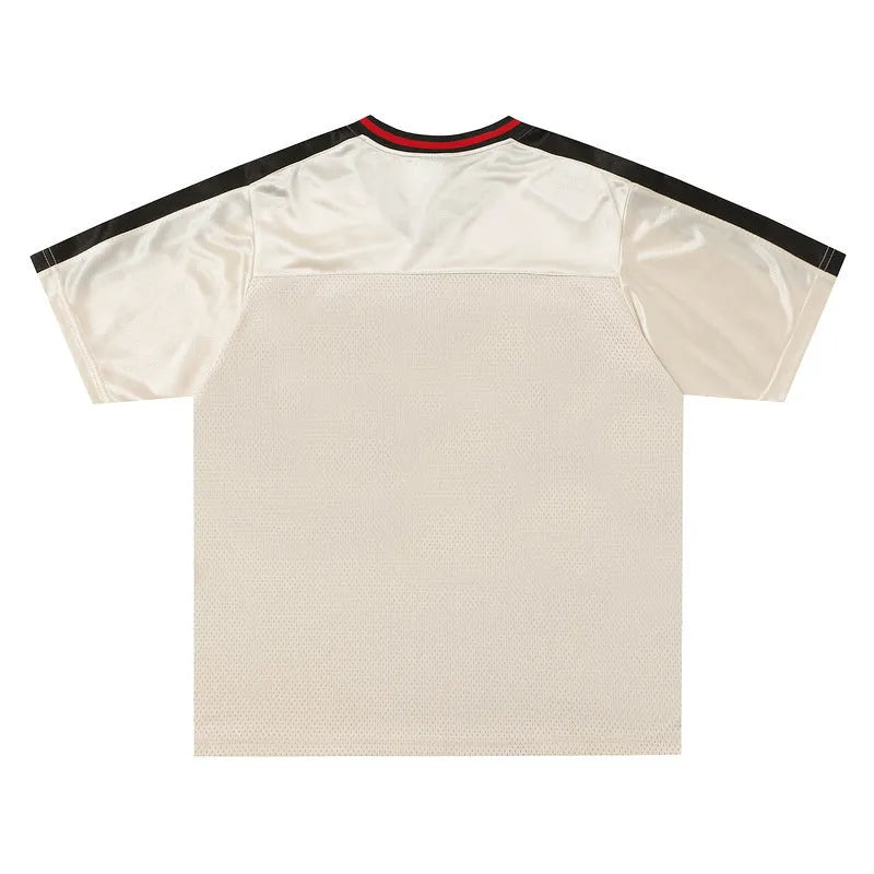 Apricot coloured V-neck sports jersey with letter pattern and drop-shoulder sleeves