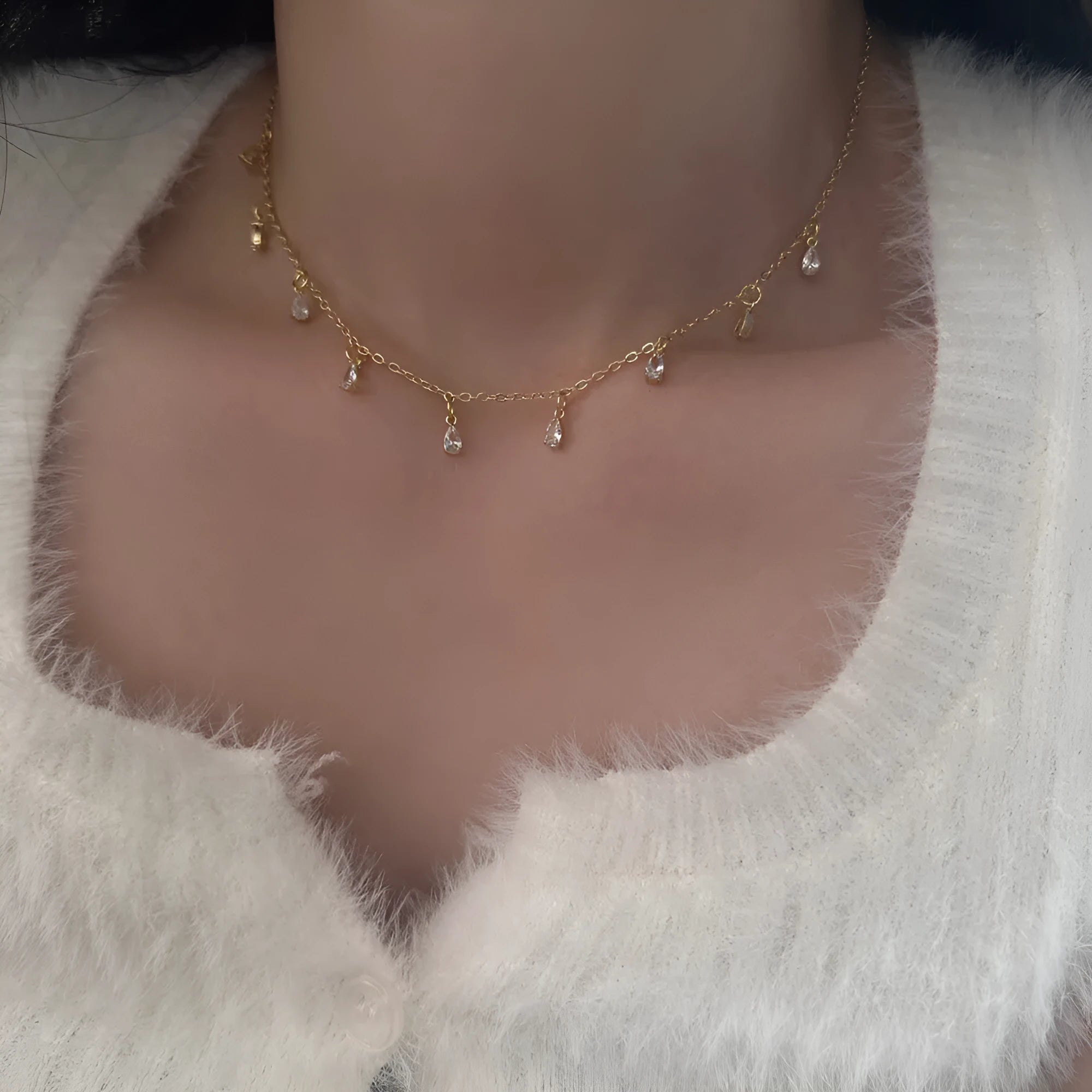 Zircon geometric necklace, earrings, and anklet set with meteor shower detail on a white background.
