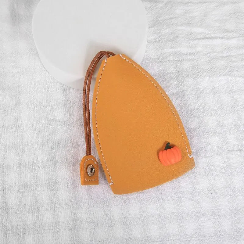 Cartoon pull-out key case in PU leather showing design options including resin fruit and big cartoon animal prints.