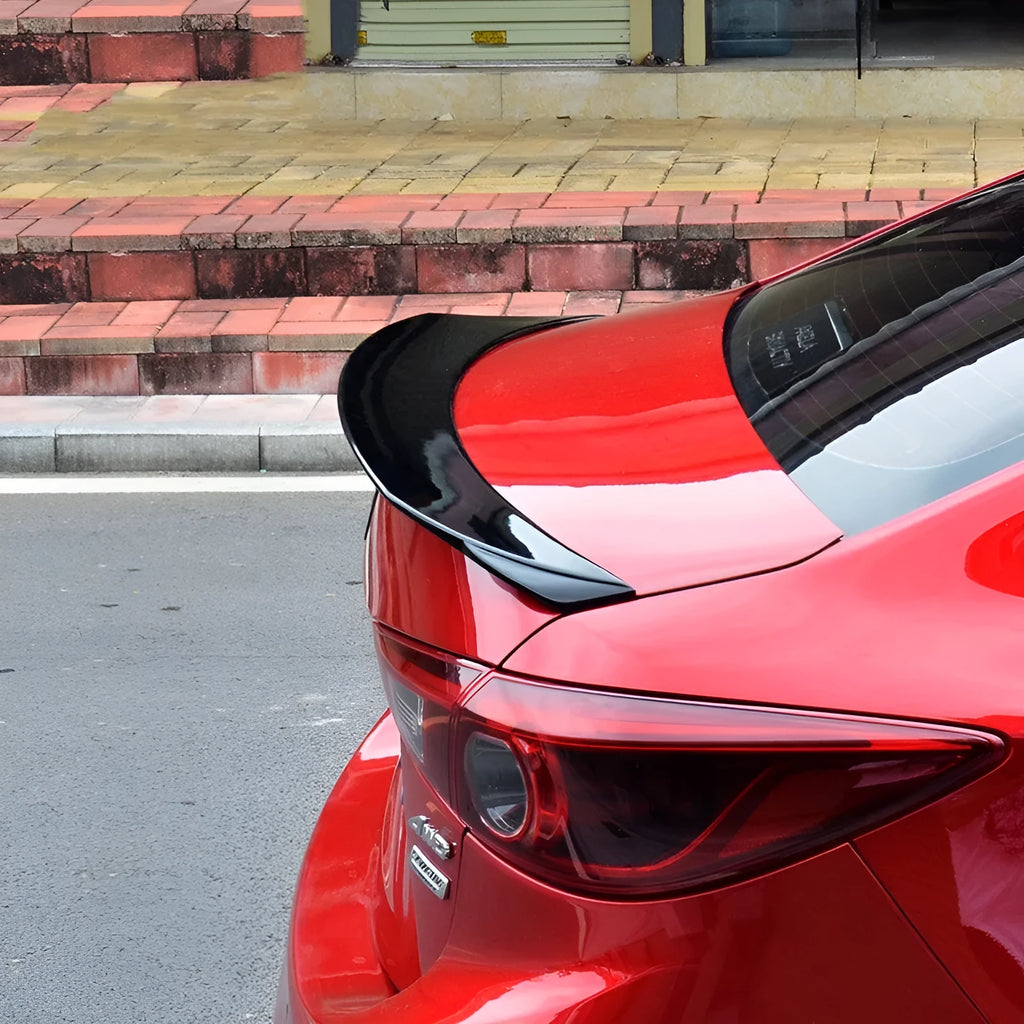 Bright black Mazda 3 Axela Exela tail trim for 2014-2021 models with large fixed wind surround design