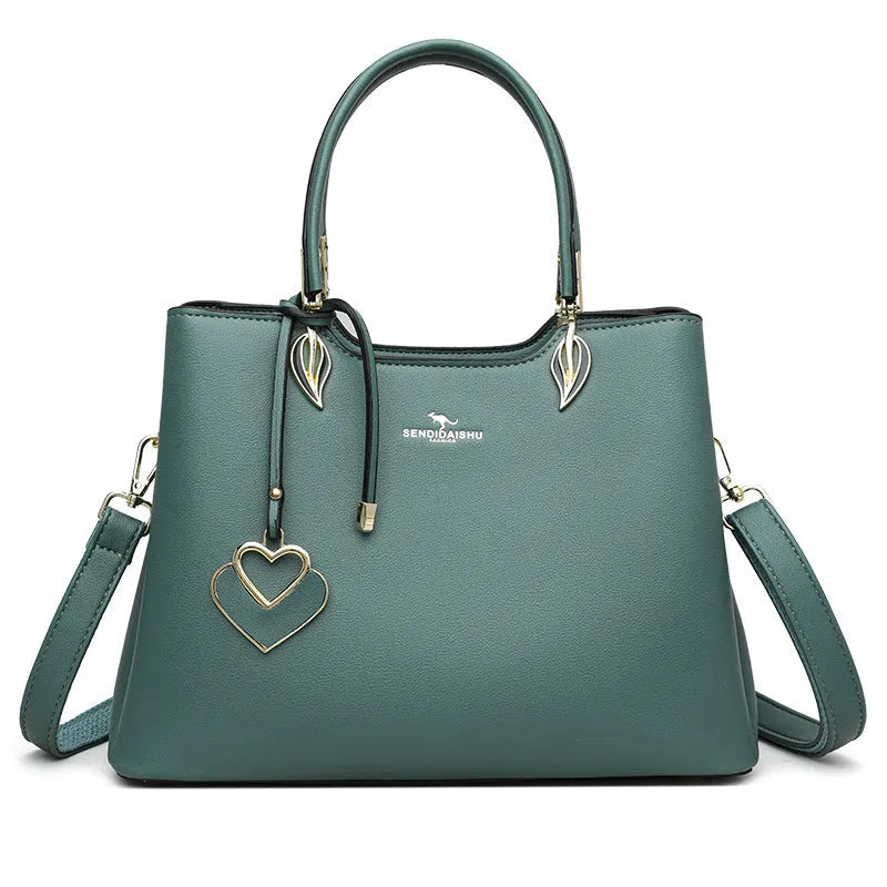 Women's black PU leather shoulder messenger bag with multi-layer compartments and visible stitching details
