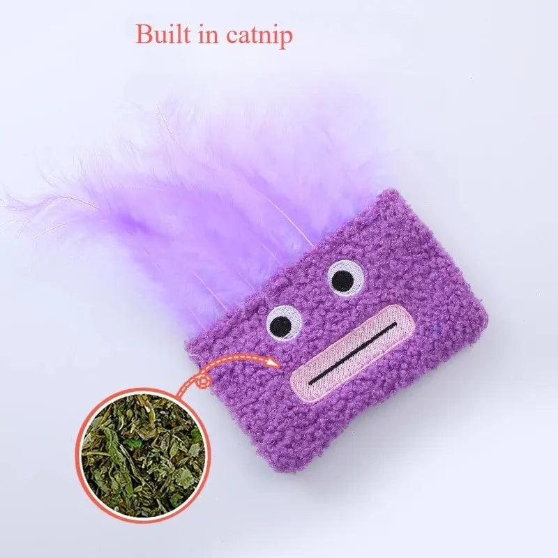 Plush cat toy shaped like a large head with a funny big mouth, in purple colour.