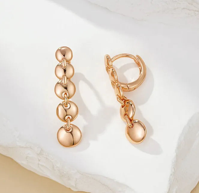 Gold woven copper circle earrings with retro circular design