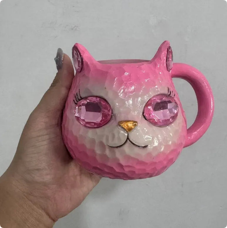 Crystal Earth Cat Cup resin craft decorative object in purple, green, blue, or pink colours.