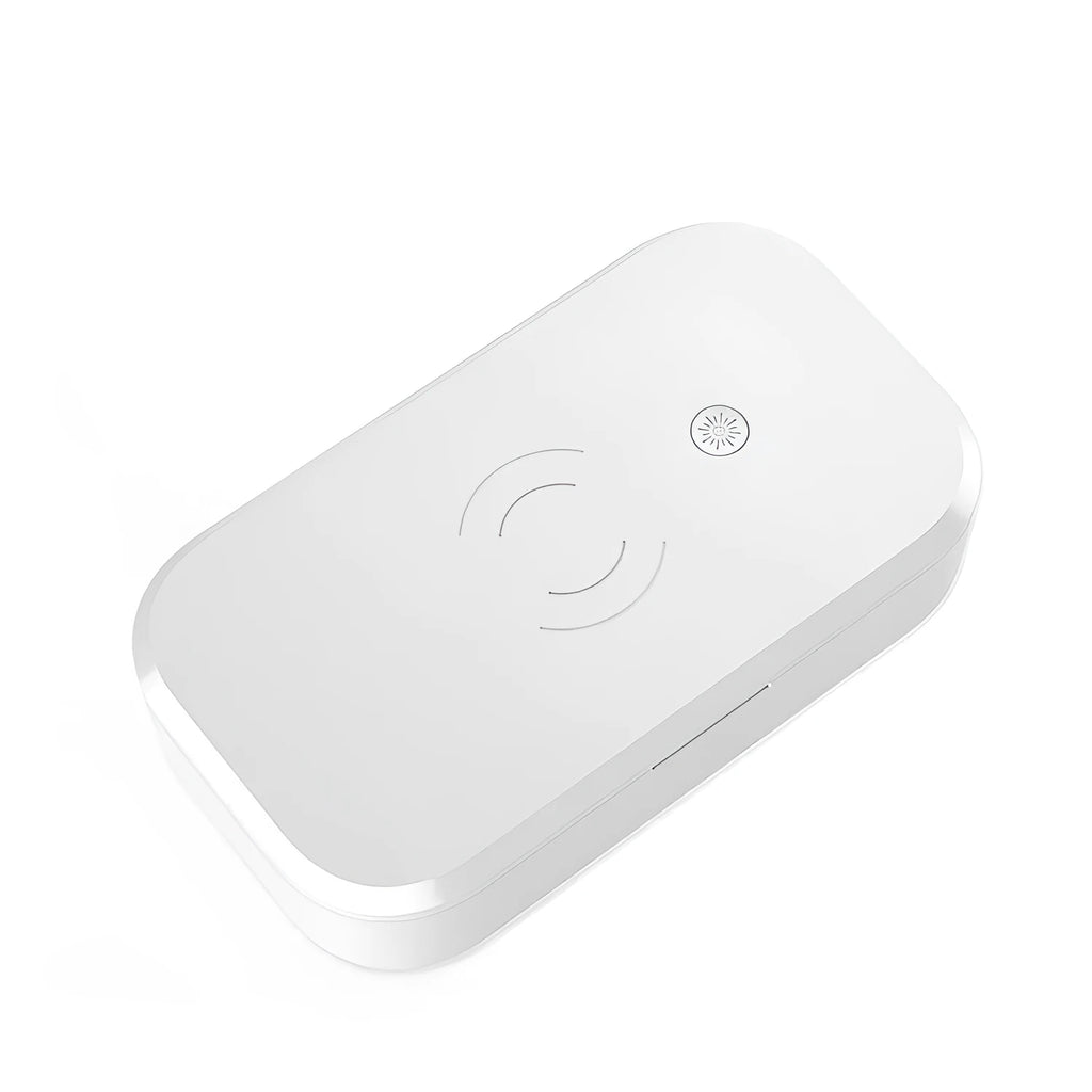 White ultraviolet disinfection box with wireless phone charging top and USB cable.