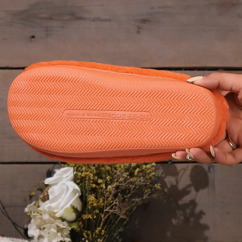 Orange pumpkin design Halloween slippers with plush lining and PVC sole for indoor home wear