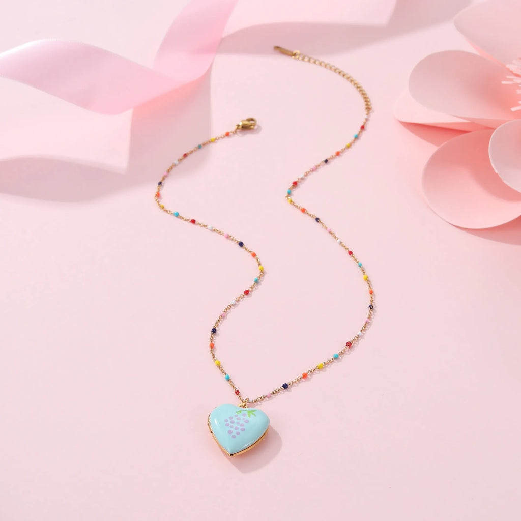 Stainless steel fruit pendant necklace with gold plating showing heart and fruit charm designs on adjustable chain