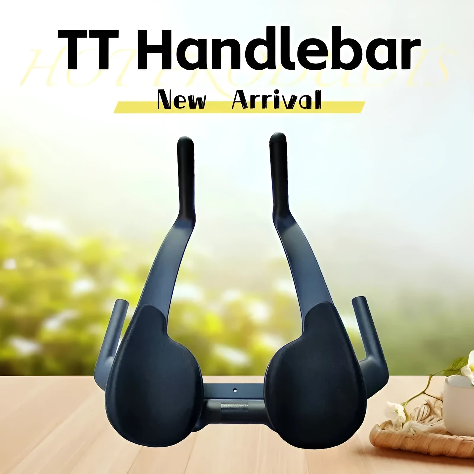 Black carbon fibre TT bicycle handlebars showing angled extensions and clamp area.