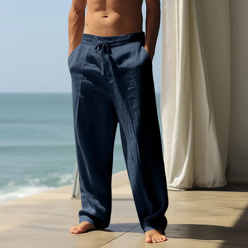 Men's solid colour cotton casual trousers shown in various colours including black, grey, and khaki.