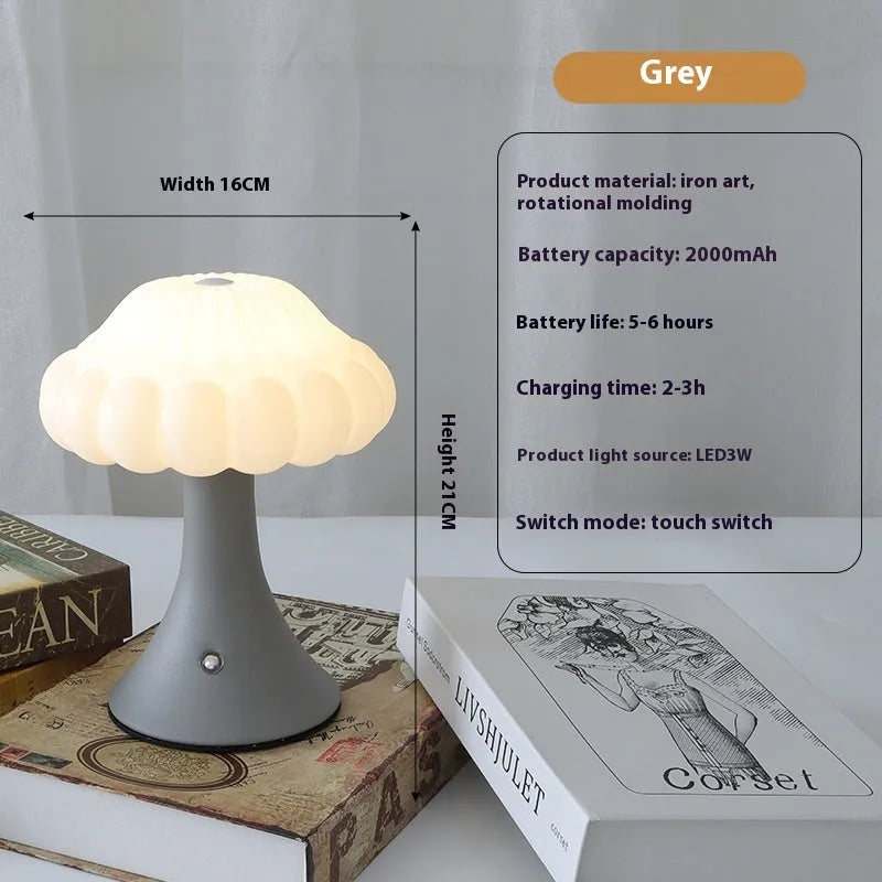 Mushroom-shaped touch control night lamp in wood grain colour on a wooden table.