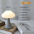Mushroom-shaped touch control night lamp in wood grain colour on a wooden table.
