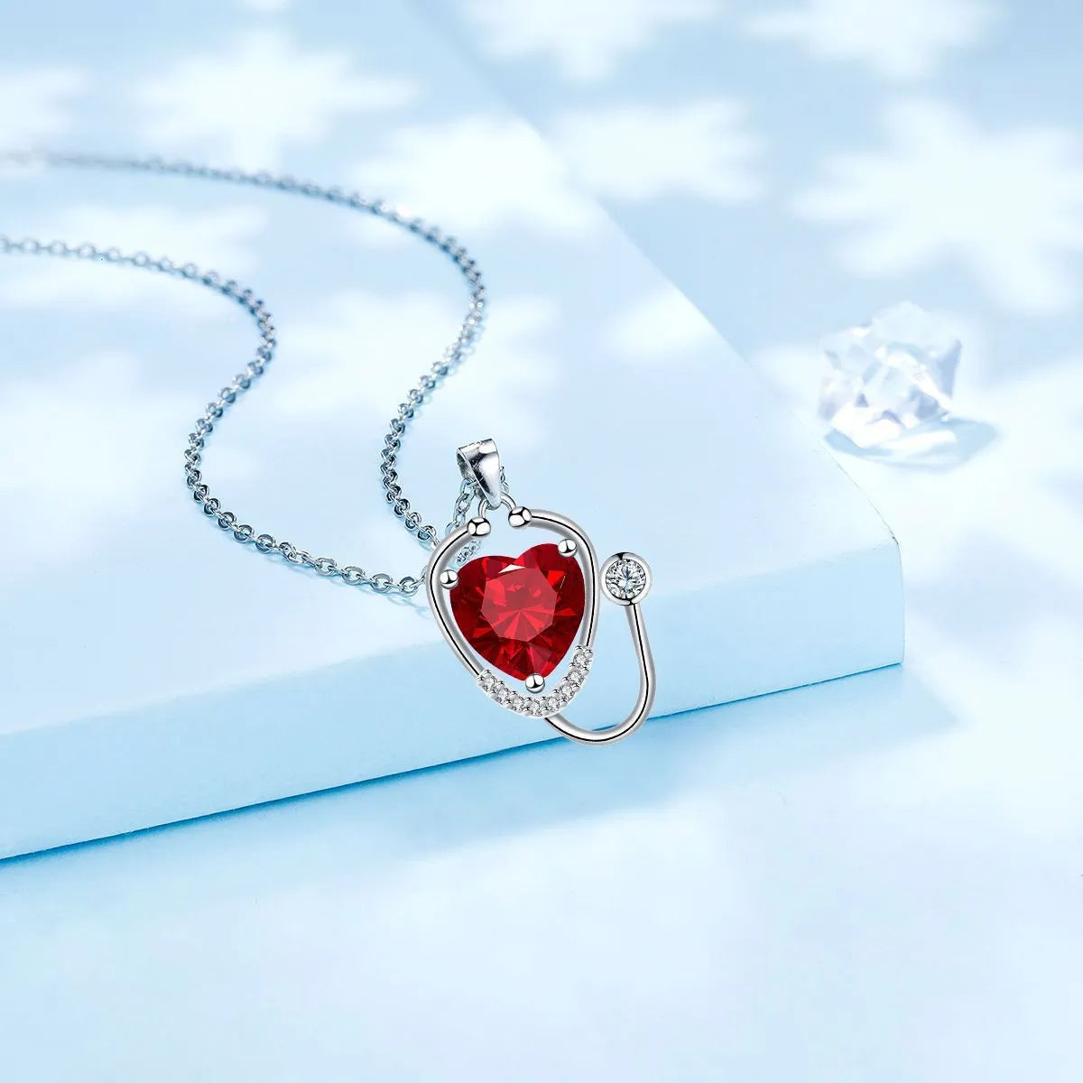 Women's fashion necklace with wings cross stethoscope pendant in red diamond colour