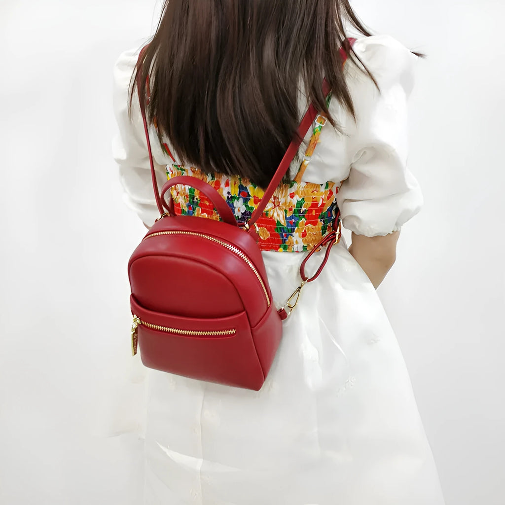 Soft PU mini backpack in multiple colours showing outer pocket and street style design