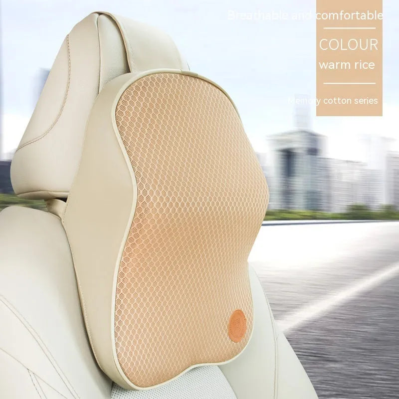 Black and brown memory foam car headrest pillow and lumbar support cushion set on a car seat.